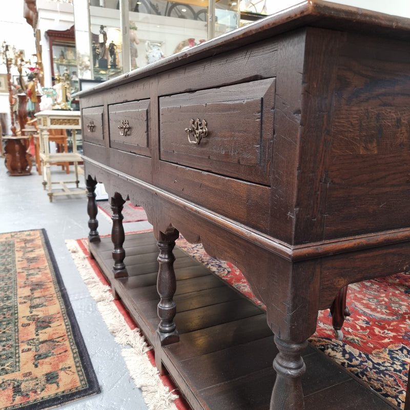 A very hard to find Vintage English kitchen dresser base of narrow proportions, sourced from France. In good original detailed condition.