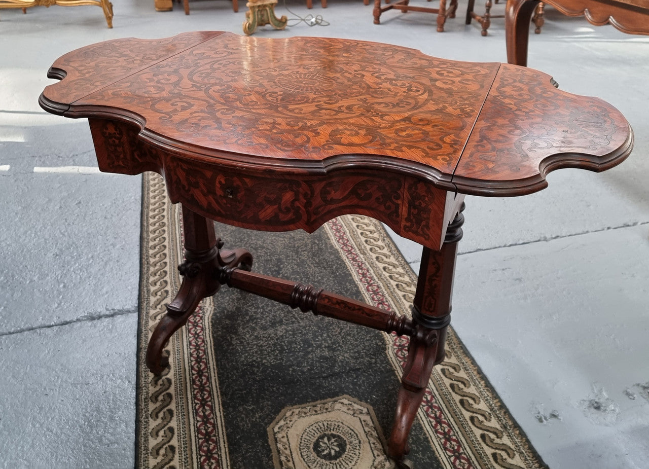 Fabulous marquetry inlaid side table with marquetry extensions and one drawer. Stunning side table or small ladies desk.