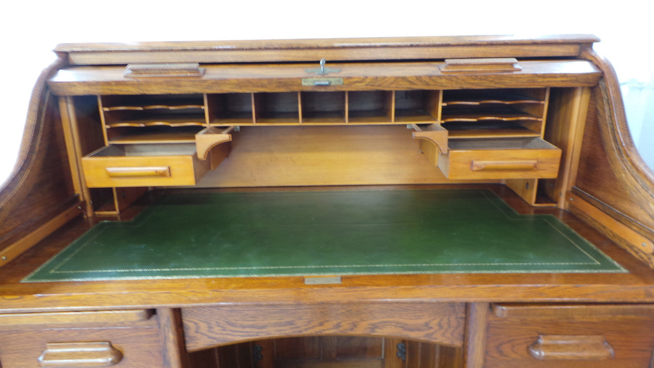 An Antique English Oak Roll Top Desk