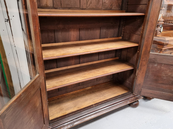 Substantial French Henry 2nd Walnut two door bookcase. It has five fully adjustable shelves and has been sourced from France. It is in good original detailed condition.