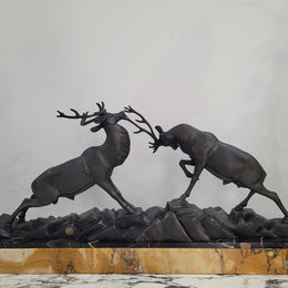French Art Deco bronzed spelter and marble"Fighting Stags" statue by renowned artist and sculptor "Irenee Rochard".