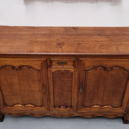 Amazing French Oak early 19th Century two door sideboard with one drawer and two fixed shelves. Sourced from France and in good original detailed condition.