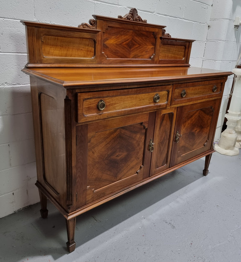 Fabulous Antique two door Blackwood and Fiddleback sideboard with lovely presence and also plenty of room for storage. In original detailed condition.