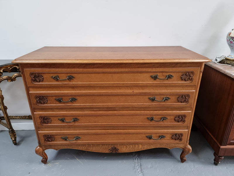 Fabulous French light Oak of chest of four drawers with lovely decorative carving. In good original detailed condition.