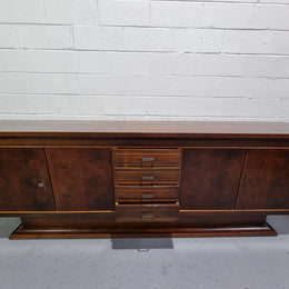 Amazing French Walnut Art deco four door buffet. The doors either side open to a fixed shelf and plenty of added storage with four drawers. In good original detailed condition.