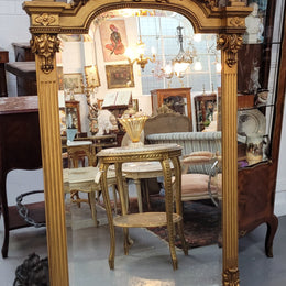 French Louis XVI style Napoleon III (1870’s) gilt mantle mirror. Beautifully carved and decorated with original bevelled mirror showing signs of age. It is in good original detailed condition and has been sourced from France.
