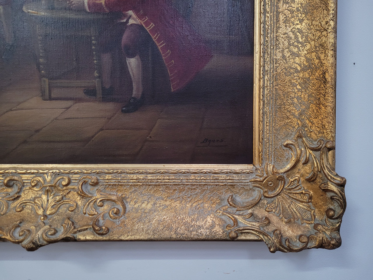 An engaging gilt framed signed oil on canvas of a "French Interior Scene". It has been sourced from France and is in good original detailed condition.