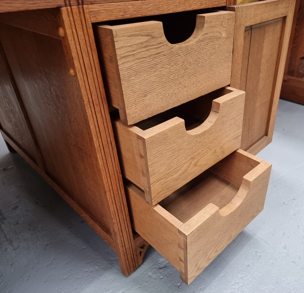 French Oak Art Deco full partners desk with leather top. Plenty of storage with both sides having three drawers at the top and two cupboards on both sides, one side has a filing section with three internal drawers and the other has a shelf on one side with three internal drawers as well. In good original detailed condition.