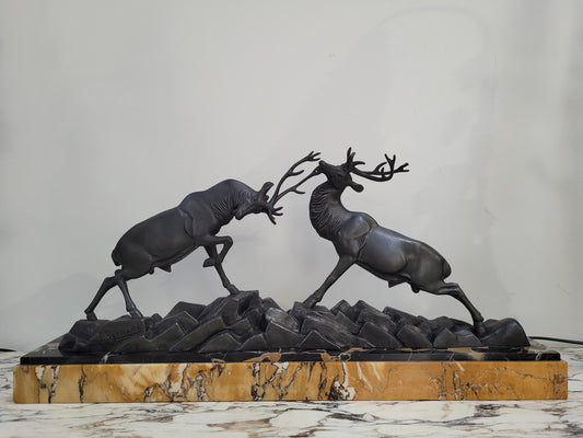 French Art Deco bronzed spelter and marble"Fighting Stags" statue by renowned artist and sculptor "Irenee Rochard".
