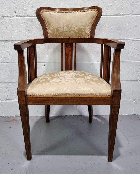 Charming Edwardian inlaid walnut upholstered armchair. In good original condition.