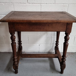 Rustic French Oak side table/desk with turned legs. In good original condition.