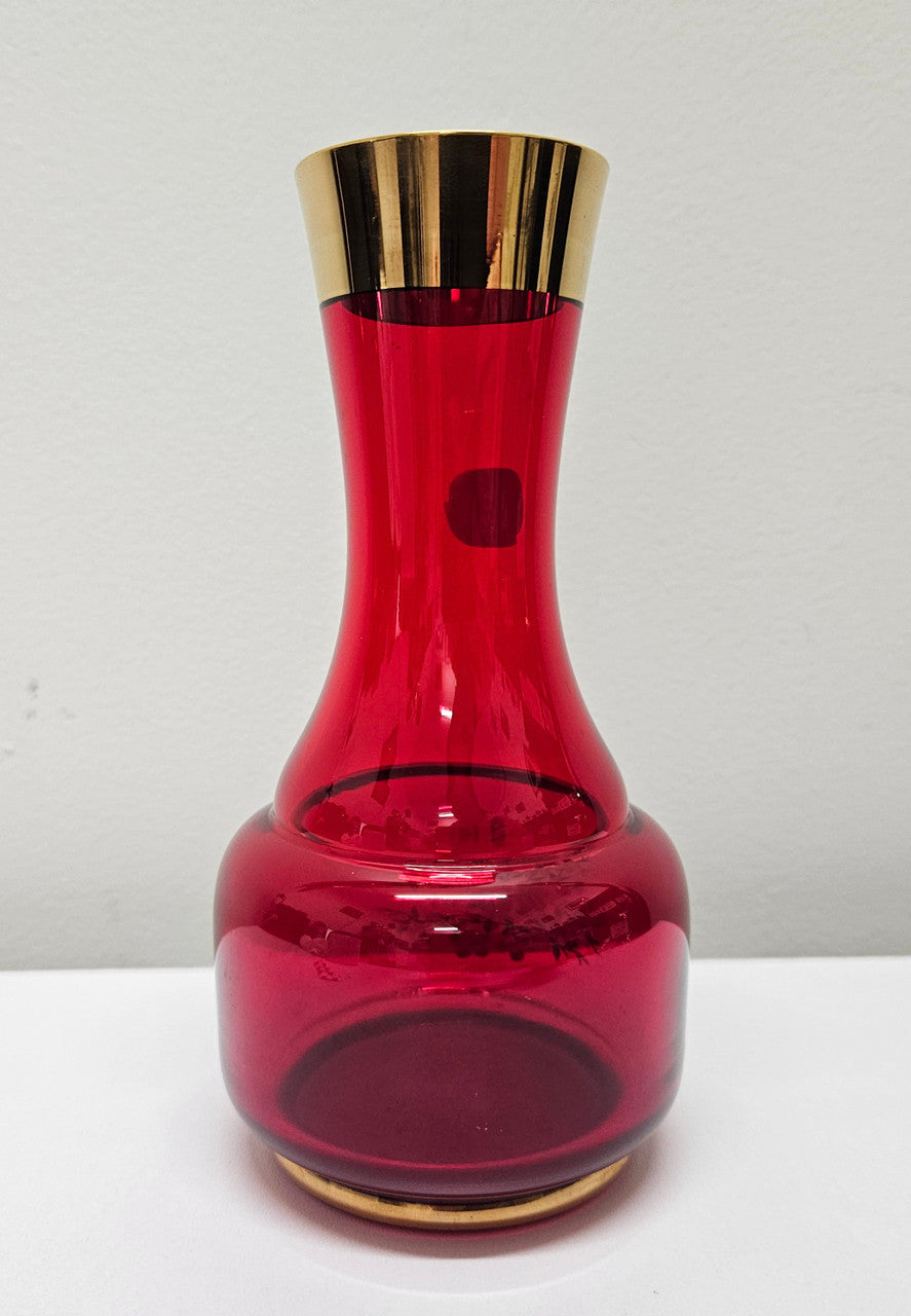 Lovely Bohemian ruby red glass vase with hand painted flowers and a guilt trimmings. It is in good original condition. Please see photos as they form part of the description.