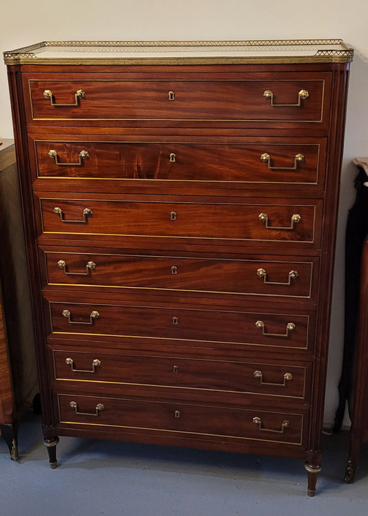 Absolutely beautiful French Empire seven drawer semainier with a lovely white carrara marble top and amazing bronze handles. It has its original key and is in good original detailed condition.