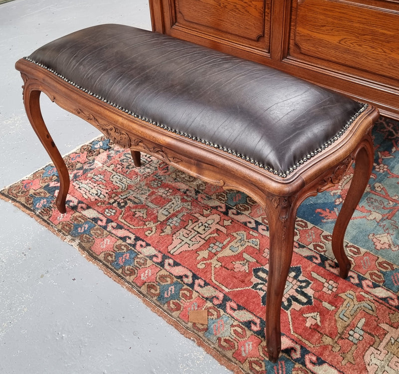 Impressive French Louis 15th style walnut upholstered duet leather stool. Very Good Condition.  Circa: 1930’s, sourced in France.