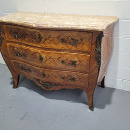 French three drawer marquetry inlaid marble top commode with decorative ormolu mounts. In good original detailed condition.