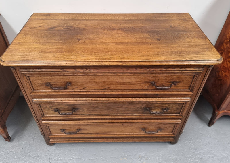 French solid Oak Louis 14th style chest of three drawers. It has three large spacious drawers and it has been sourced from France. It is in good original detailed condition.