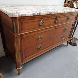 Louis XVI style Mahogany marble top cupboard. It has two drawers at the top and two doors at the bottom all with decorative handles and mounts. Stunning white marble top and all in good original detailed condition.