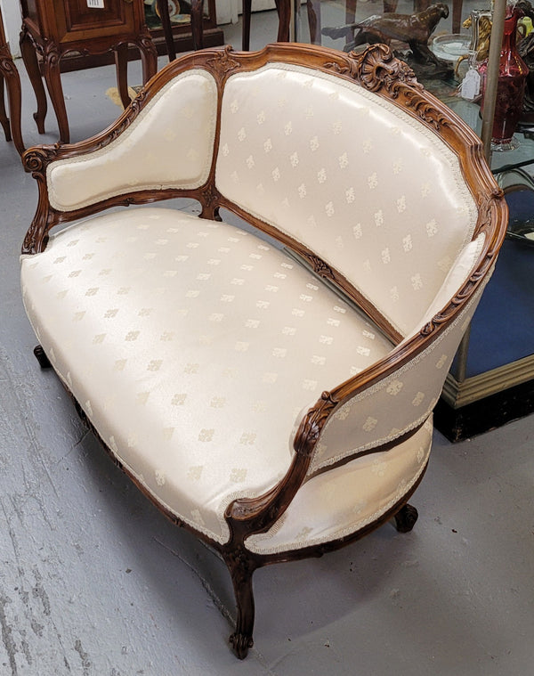 Pretty French Louis XV style small Walnut settee with very good upholstery. Sourced from France and in good original condition, please view photos of the upholstery as it helps form part of the description.