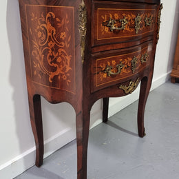 A stunning French petite two drawer inlaid Rosewood commode. In good original detailed condition.