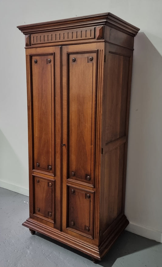 French Henry II style Walnut linen storage cupboard with nine pull out shelves. This piece could be very functional for a range of different purposes including shoe storage. It is in good original detailed condition, please note the door lock no longer functions and opens by pulling the door.