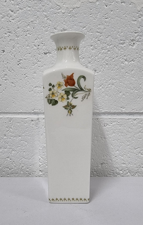 Lovely floral Wedgwood white vase with a pretty design in good condition, please view photos as they help form part of the description.