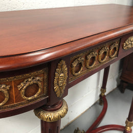 Fully restored decorative French style mahogany console table, with beautiful ormolu mounts and in very good condition.