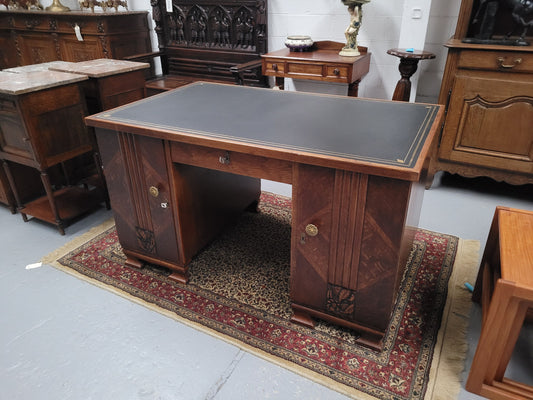 Stylish French Oak Art Deco twin pedestal desk with stunning tooled leather top. Plenty of storage space with central drawer, a cupboard either side both sides having two shelves and a pull out drawer at the top. We also have the matching bookcase which has been listed separately. Sourced from Franc and is in good detailed condition with all locks and keys working.