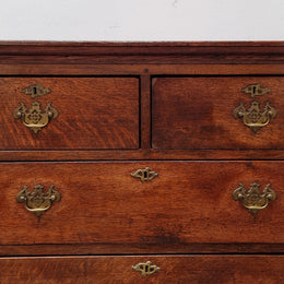 Early 19th Century English Oak chest on stand. It has been sourced in France and has plenty of storage space with eight drawers. In good original detailed condition.