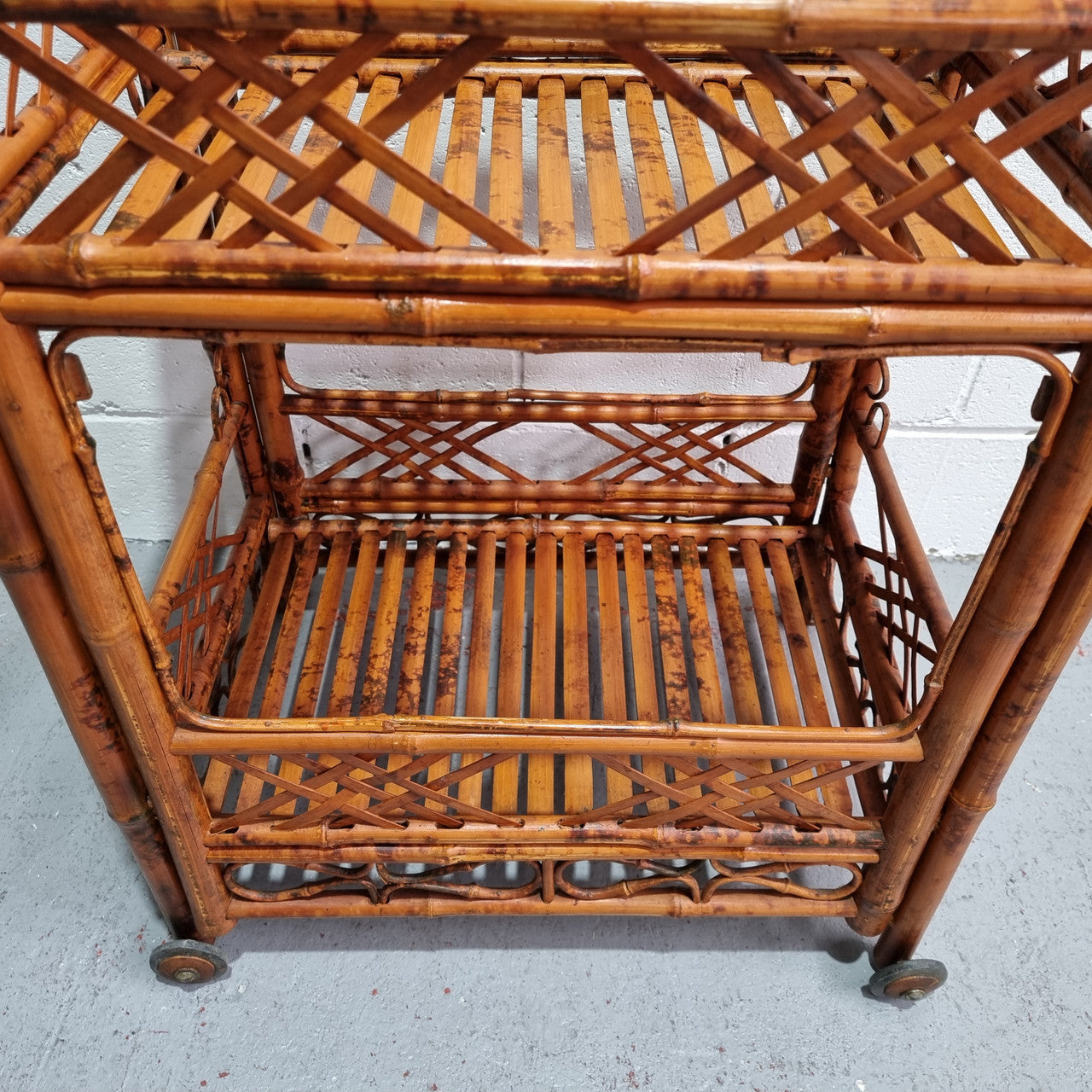 Excellent Vintage Tortoiseshell Bamboo two tier auto trolley. It has been sourced locally and is in fantastic original detailed condition .