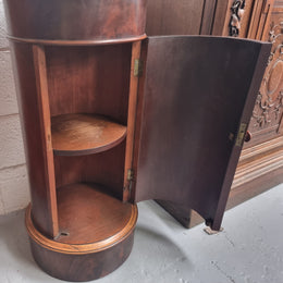 Unusual Empire flame Mahogany cylindrical marble topped bedside/pedestal. Would make an ideal pedestal with added storage inside or could be used as a bedside. Sourced from France and is in good original detailed condition.