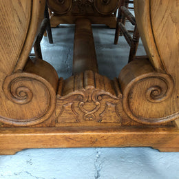 French oak fixed farmhouse table with a charming harp-shaped base. In good original condition and can seat 6-8 people. Circa 1930.