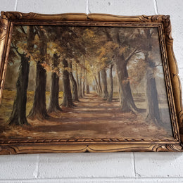 French signed oil on canvas depicting a charming landscape scene in a decorative gilt frame. It is in good original detailed condition and has been sourced from France.