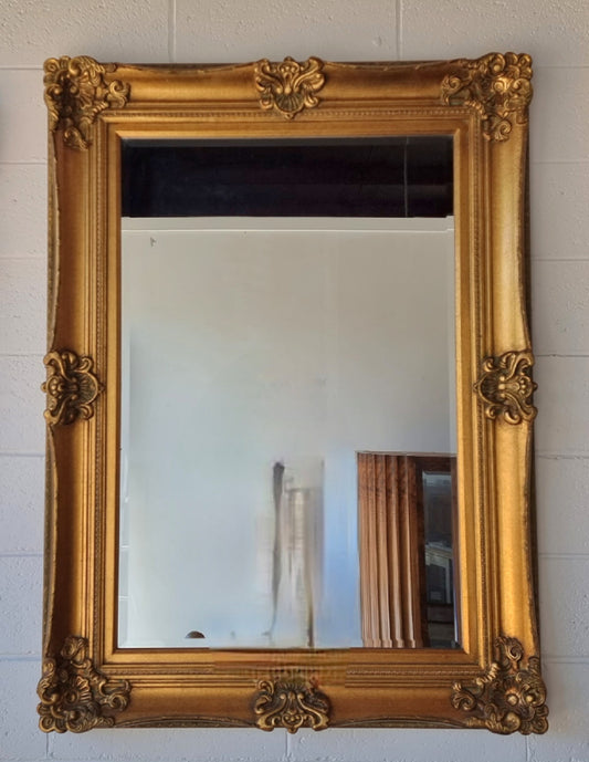 Vintage decorative gilt bevelled mirror. In good original detailed condition.