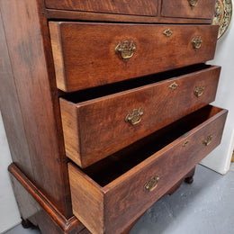 Early 19th Century English Oak chest on stand. It has been sourced in France and has plenty of storage space with eight drawers. In good original detailed condition.