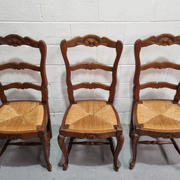 Lovely set of six French oak rush seated provincial dining chairs. They have been sourced from France and are in good detailed condition.