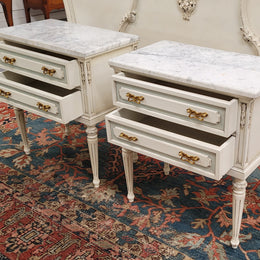 Attractive pair of Vintage French Louis 16th style two drawer marble topped bedsides. They have been sourced from France and are in good original condition.
