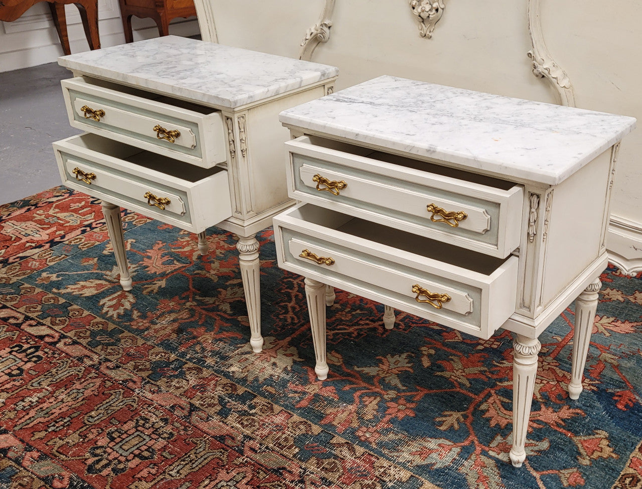 Attractive pair of Vintage French Louis 16th style two drawer marble topped bedsides. They have been sourced from France and are in good original condition.