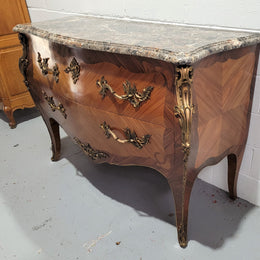 Stunning French Walnut and Rosewood Louis XV style two drawer commode with a beautiful marble top and ormolu mounts. In good original detailed condition.
