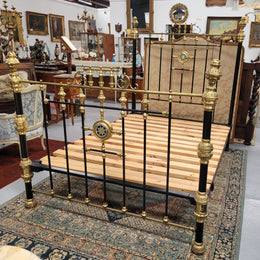 Rare Antique cast iron and brass Victorian queen size bed. Comes with custom made slats.  It has been sourced locally and is in good original condition.