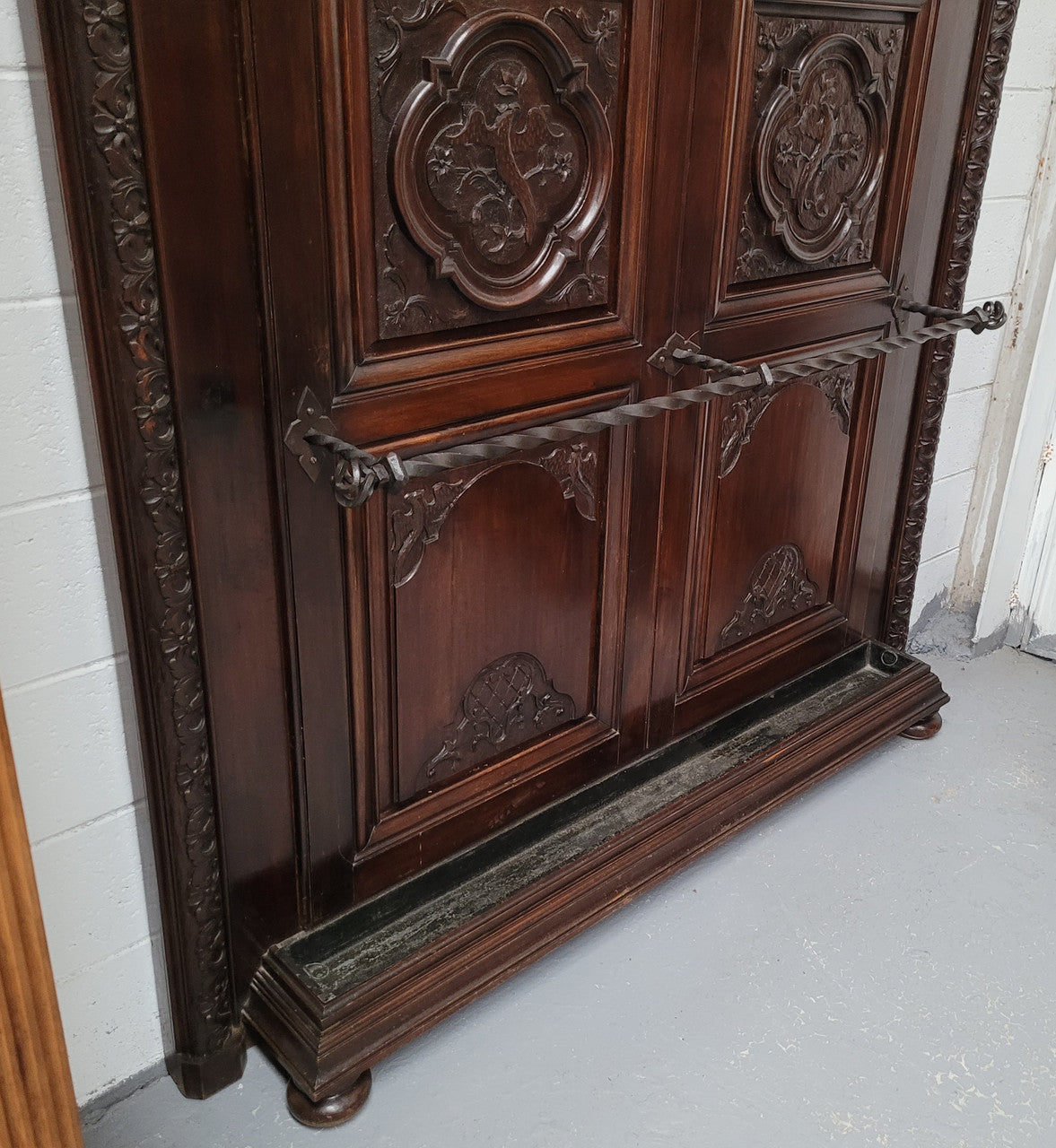 French Henry II 19th century narrow proportioned Walnut hall stand. Full of Character with stunning hand forged wrought iron hooks and interesting carvings. In good original detailed condition.