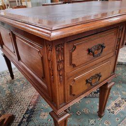 Substantial French Louis XVI style Oak partners desk. It has a beautiful leather top, two drawers on either side and decorative carvings throughout. Sourced from France and in good original detailed condition.