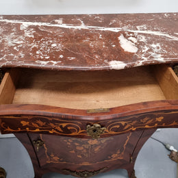 Stunning French Transitional style Mahogany marquetry inlay salon cabinet in the bombe shape. It has one draw, one shelf, marble top & ormolu decoration. Sourced from France and in good original detailed condition.
