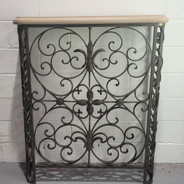 Stunning Art Deco wrought iron and marble top console table. It has amazing decorative iron work at the bottom and a beautiful marble top. It is in good original detailed condition.