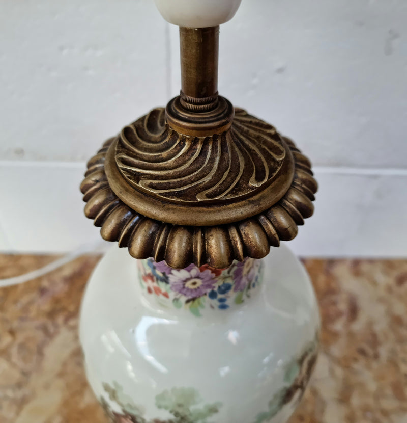 Beautiful French ceramic hand painted and transferred decorative table lamp. It has a lovely gilt bronze base and in good working order.