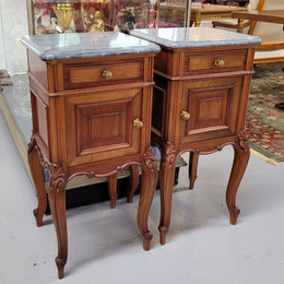 Pair of Walnut Louis XV style grey marble top bedside cabinets. Single drawer, one cupboard and lovely French cabriole legs. They have been sourced from France and are in good original condition.