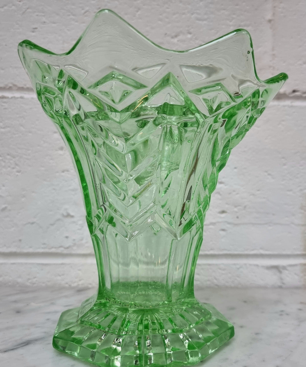 Beautiful green depression glass flower vase with insert. in good original condition.