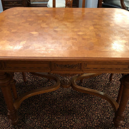 Lovely carved French Oak dining table with a parquetry top and six matching upholstered chairs in good original detailed condition.