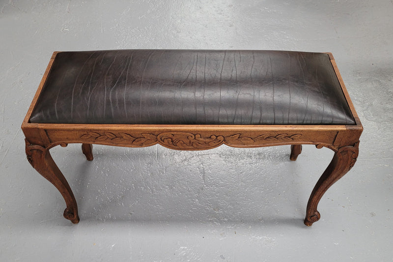 French Oak newly upholstered leather look duet stool. In good original detailed condition and new upholstery.