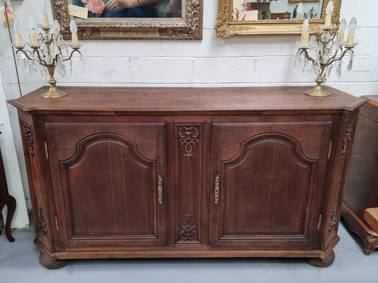 Late 18th Century French Oak carved two door sideboard. In good original detailed condition.