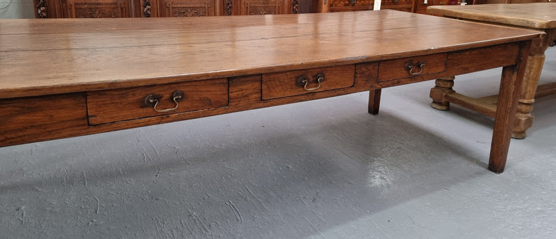 Amazing 19th Century French Oak Farmhouse style dining table with three drawers. It is made from three large planks of wood which is very hard to find. It is also very wide with a width of 105.5 cm. It is in good original detailed condition.